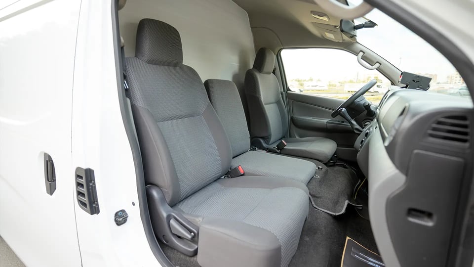 Used 2022 Nissan Urvan High Roof in White – Front Passenger Side Cabin View for Sale at First Choice Cars Dubai Sharjah