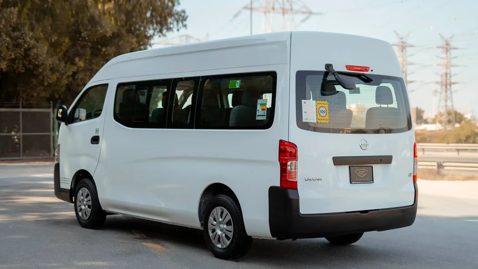 Used 2019 Nissan Urvan High Roof in White – Left Back Diagonal (45°) View for Sale at First Choice Cars Dubai Sharjah