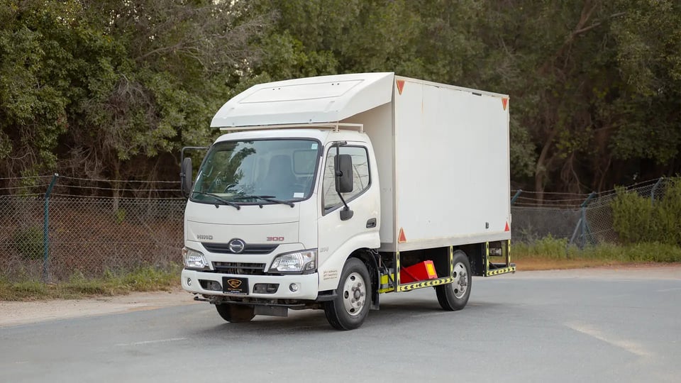 Used 2019 Hino 300 Dry Box in White – Left Front Diagonal (45°) View for Sale at First Choice Cars Dubai Sharjah