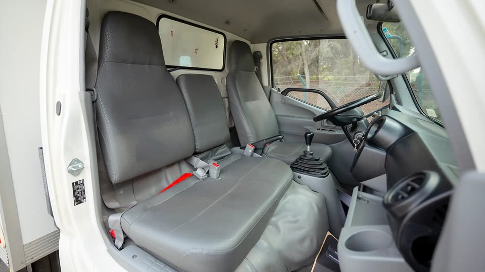 Used 2019 Hino 300 Dry Box in White – Front Passenger Side Cabin View for Sale at First Choice Cars Dubai Sharjah