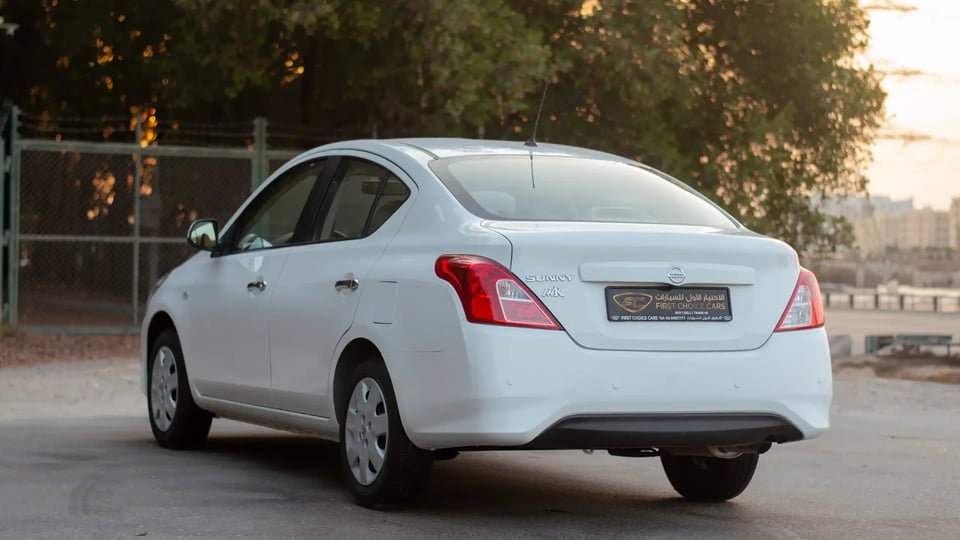 Used 2023 Nissan Sunny SV in White – Left Back Diagonal (45°) View for Sale at First Choice Cars Dubai Sharjah