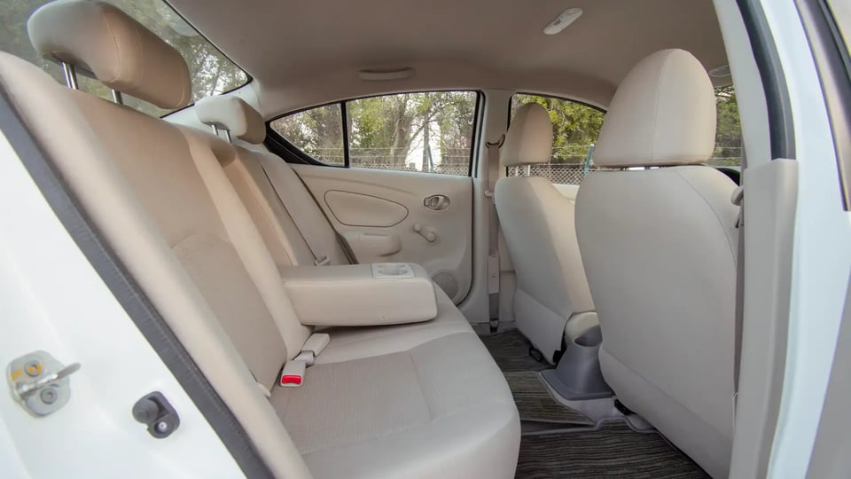 Used 2023 Nissan Sunny SV in White – Rear Passenger Side Cabin View for Sale at First Choice Cars Dubai Sharjah