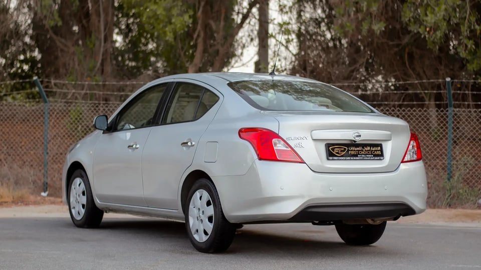 Used 2022 Nissan Sunny SV in Silver – Left Back Diagonal (45°) View for Sale at First Choice Cars Dubai Sharjah