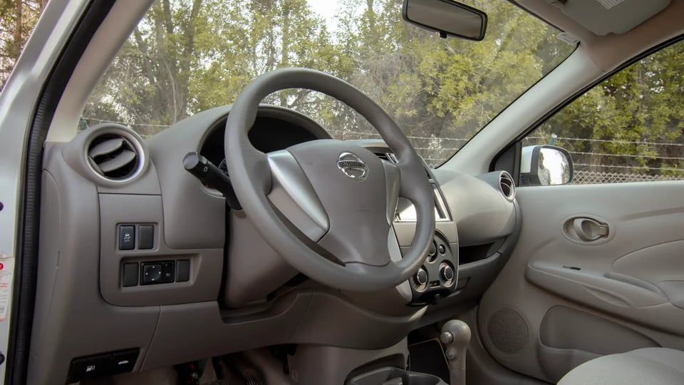 Used 2022 Nissan Sunny SV in Silver – Driver Side Dashboard & Steering View for Sale at First Choice Cars Dubai Sharjah