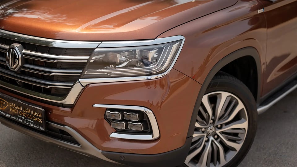 Used 2021 MG RX8 Luxury in Brown – Headlight Close-up for Sale at First Choice Cars Dubai Sharjah