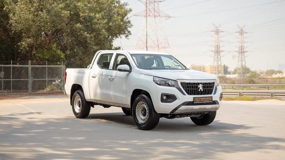 Used 2023 Peugeot Landtrek Double Cabin in White – Right Front Diagonal (45°) View for Sale at First Choice Cars Dubai Sharjah