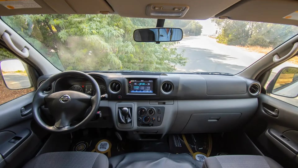 Used 2021 Nissan Urvan High Roof in White – Front Cabin / Dashboard Full View for Sale at First Choice Cars Dubai Sharjah