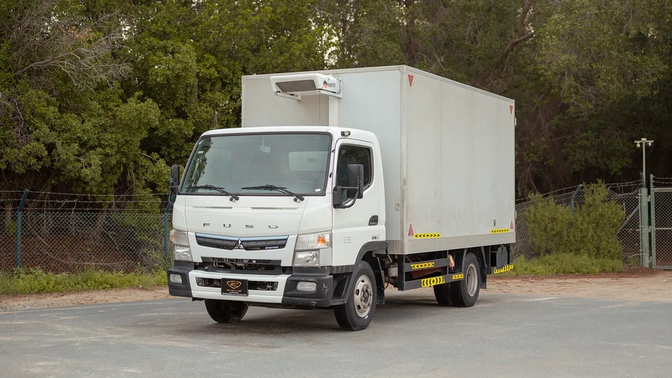 Used 2023 Mitsubishi Canter Chiller Box in White – Left Front Diagonal (45°) View for Sale at First Choice Cars Dubai Sharjah
