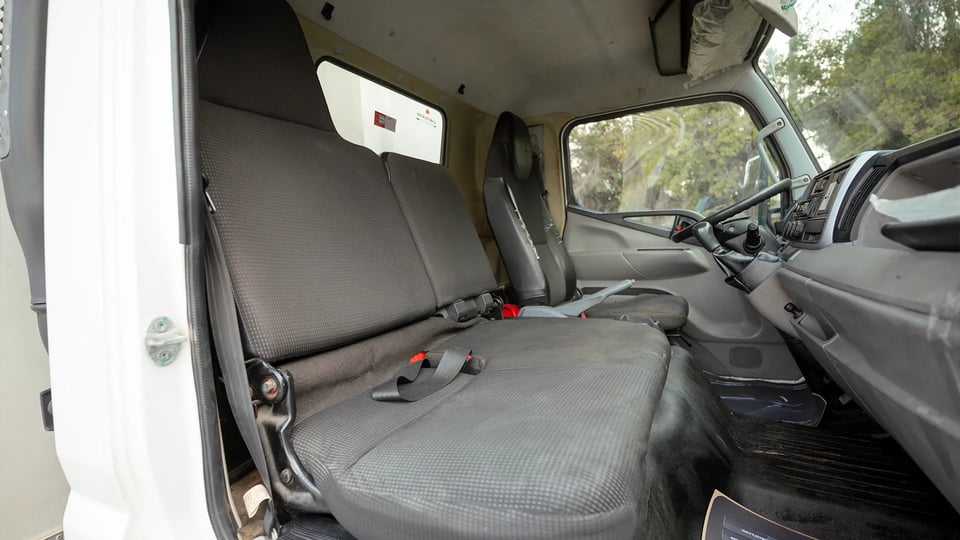 Used 2023 Mitsubishi Canter Chiller Box in White – Front Passenger Side Cabin View for Sale at First Choice Cars Dubai Sharjah