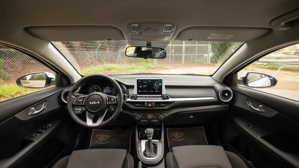 Used 2023 Kia Cerato LX in White – Front Cabin / Dashboard Full View for Sale at First Choice Cars Dubai Sharjah