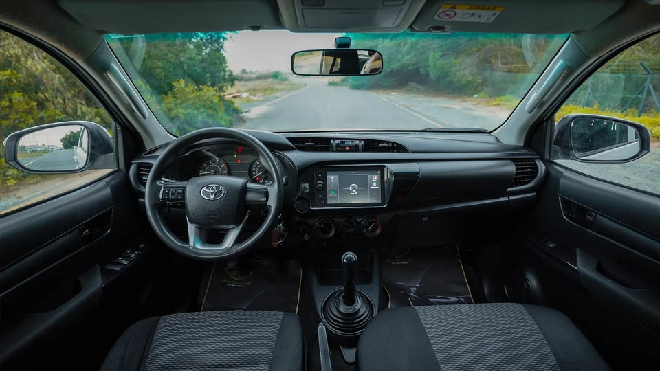 Used 2021 Toyota Hilux DLX Double Cabin in White – Front Cabin / Dashboard Full View for Sale at First Choice Cars Dubai Sharjah