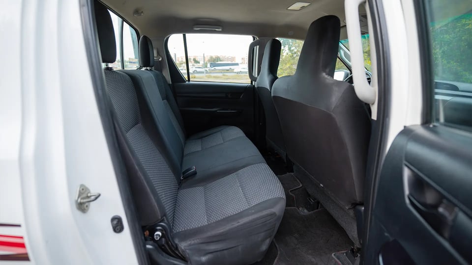 Used 2021 Toyota Hilux DLX Double Cabin in White – Rear Passenger Side Cabin View for Sale at First Choice Cars Dubai Sharjah
