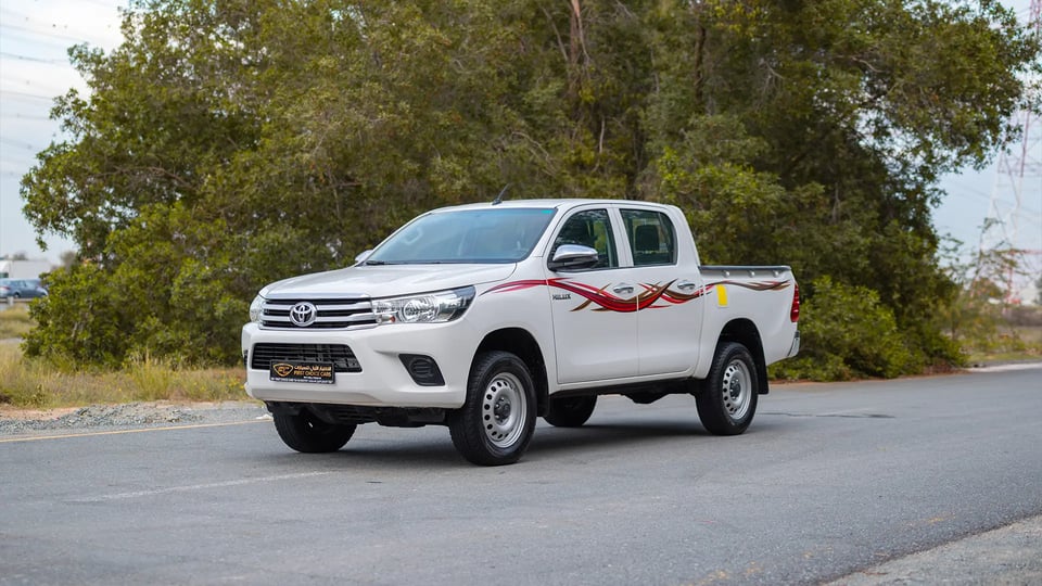 Used 2021 Toyota Hilux GLX Double Cabin in White – Left Front Diagonal (45°) View for Sale at First Choice Cars Dubai Sharjah