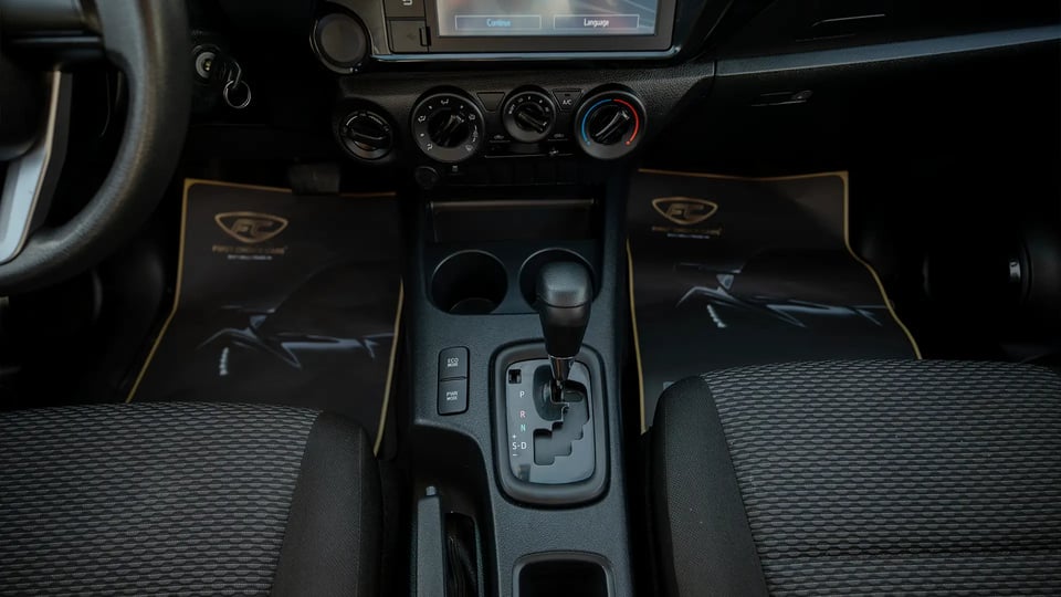 Used 2021 Toyota Hilux GLX Double Cabin in White – Center Console & Gear Shifter for Sale at First Choice Cars Dubai Sharjah