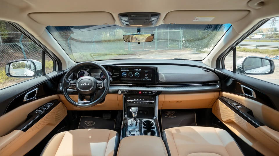 Used 2022 Kia Carnival LX in White – Front Cabin / Dashboard Full View for Sale at First Choice Cars Dubai Sharjah