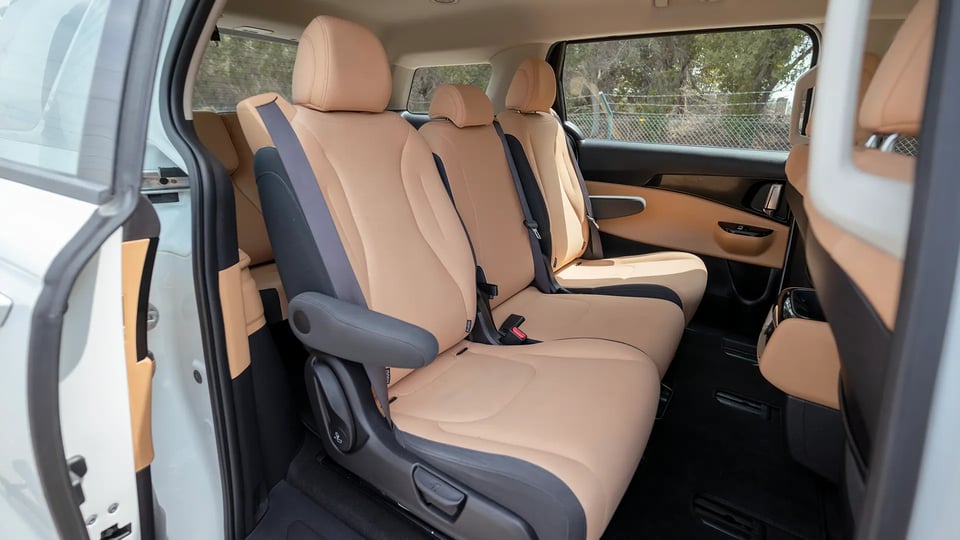 Used 2022 Kia Carnival LX in White – Rear Passenger Side Cabin View for Sale at First Choice Cars Dubai Sharjah