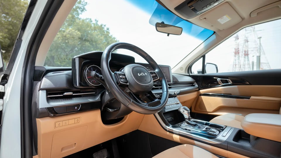 Used 2022 Kia Carnival LX in White – Driver Side Dashboard & Steering View for Sale at First Choice Cars Dubai Sharjah