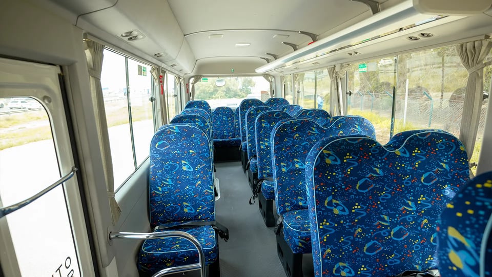 Used 2022 Toyota Coaster High Roof in White – Rear Seat View for Sale at First Choice Cars Dubai Sharjah