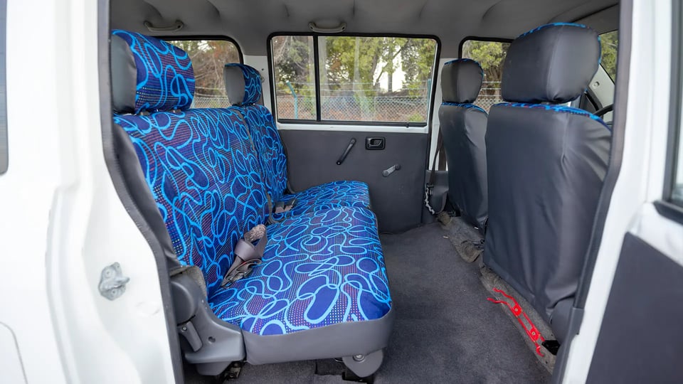 Used 2013 Suzuki APV Passanger Van in White – Rear Passenger Side Cabin View for Sale at First Choice Cars Dubai Sharjah