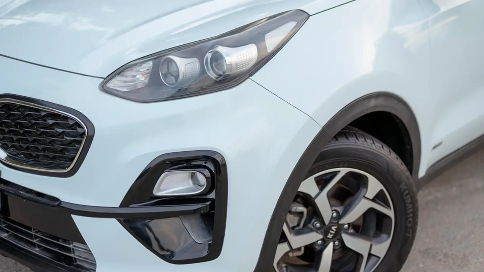 Used 2019 Kia Sportage LX in White – Headlight Close-up for Sale at First Choice Cars Dubai Sharjah
