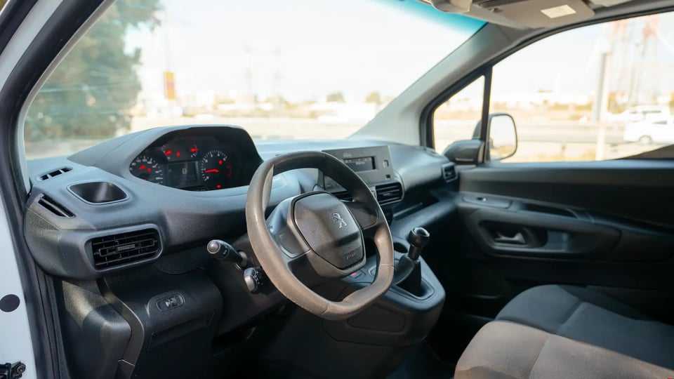Used 2022 Peugeot Partner Long Van in White – Driver Side Dashboard & Steering View for Sale at First Choice Cars Dubai Sharjah