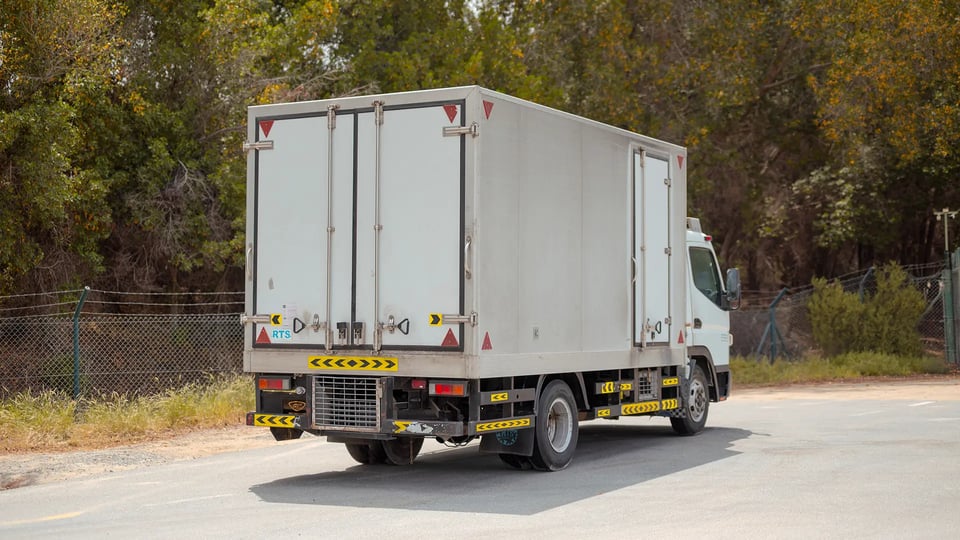 Used 2020 Mitsubishi Canter Chiller Box in White – Close-up of Alloy Wheels / Tires for Sale at First Choice Cars Dubai Sharjah