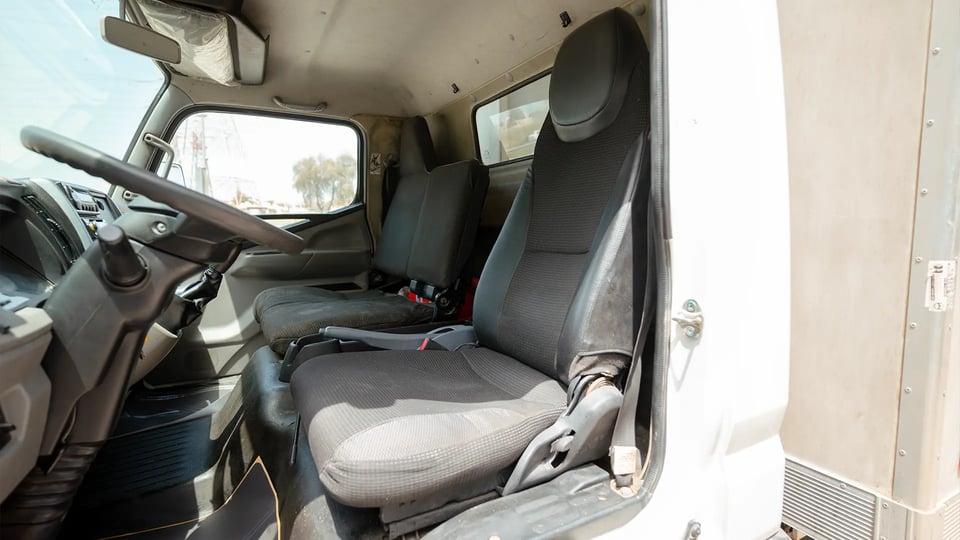 Used 2020 Mitsubishi Canter Chiller Box in White – Front Driver Side Cabin View for Sale at First Choice Cars Dubai Sharjah