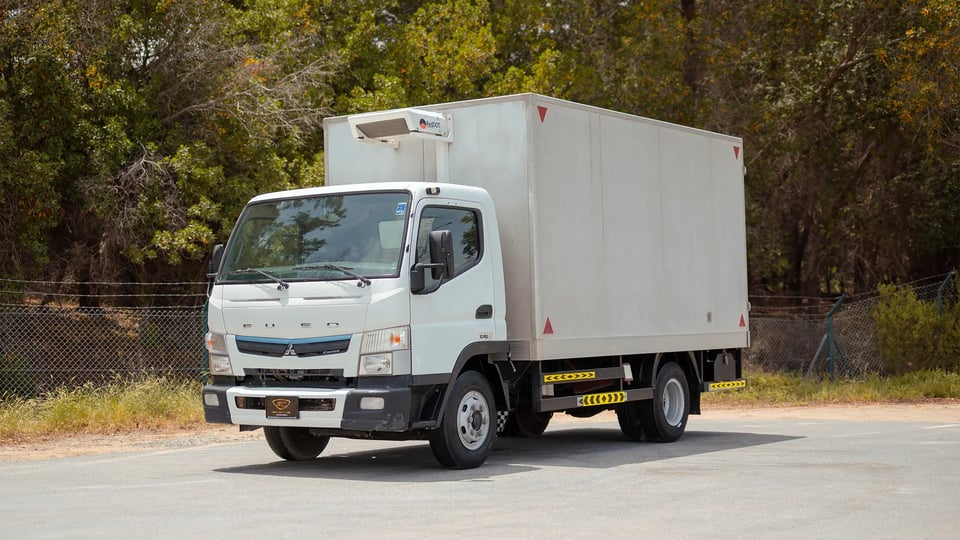 Used 2020 Mitsubishi Canter Chiller Box in White – Left Front Diagonal (45°) View for Sale at First Choice Cars Dubai Sharjah