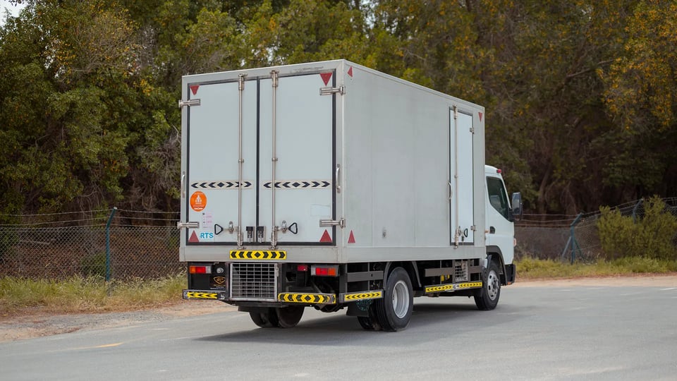 Used 2020 Mitsubishi Canter Chiller Box in White – Right Back Diagonal (45°) View for Sale at First Choice Cars Dubai Sharjah