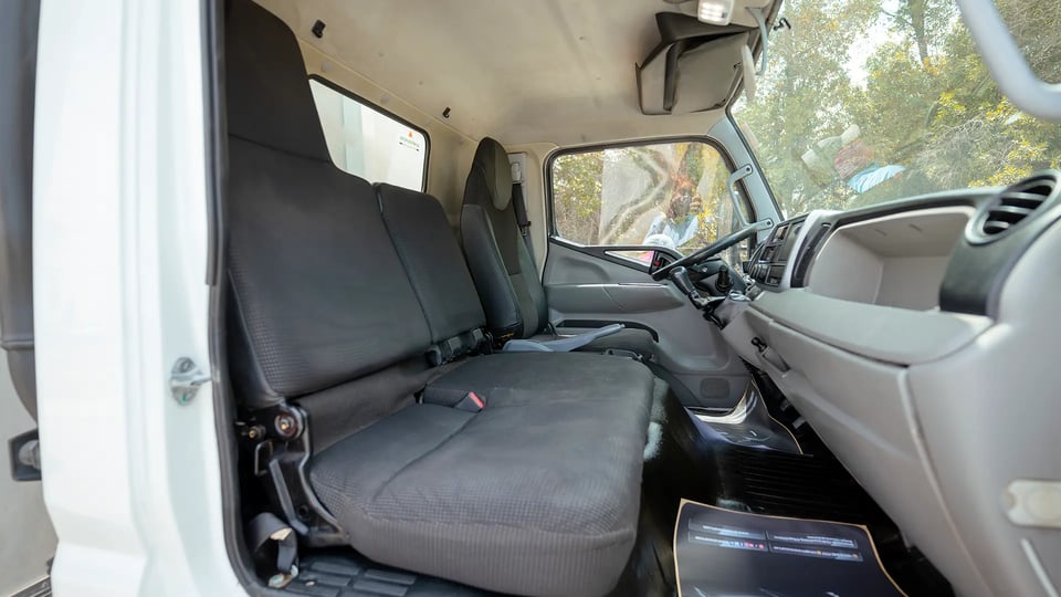 Used 2020 Mitsubishi Canter Chiller Box in White – Front Passenger Side Cabin View for Sale at First Choice Cars Dubai Sharjah