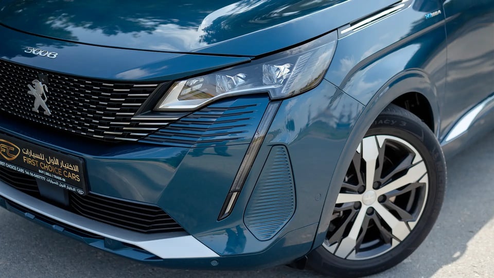 Used 2022 Peugeot 3008 Hybrid 4 GT in Blue – Headlight Close-up for Sale at First Choice Cars Dubai Sharjah