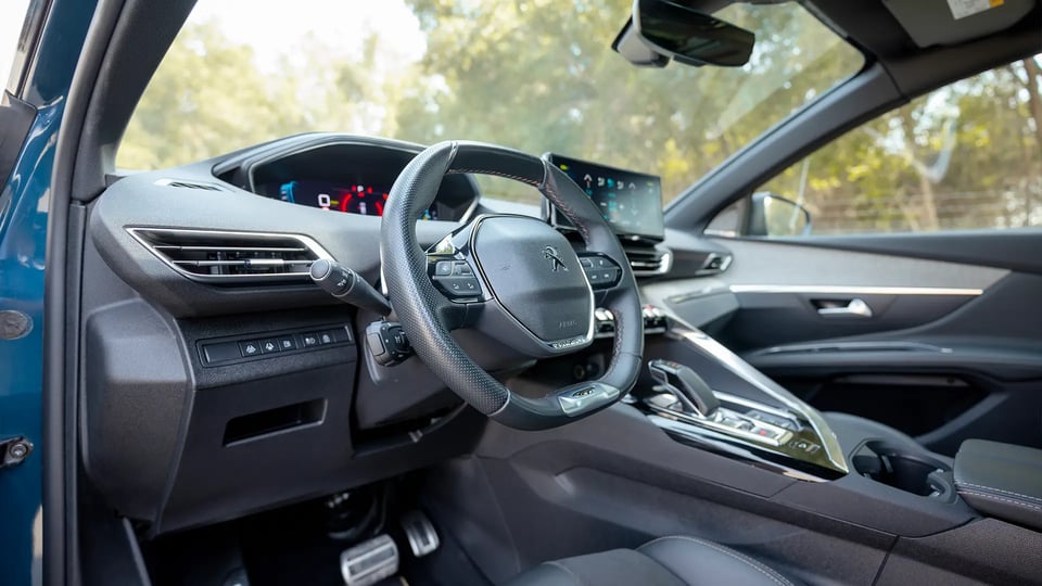 Used 2022 Peugeot 3008 Hybrid 4 GT in Blue – Driver Side Dashboard & Steering View for Sale at First Choice Cars Dubai Sharjah