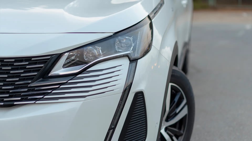 Used 2024 Peugeot 5008 GT Line in White – Headlight Close-up for Sale at First Choice Cars Dubai Sharjah