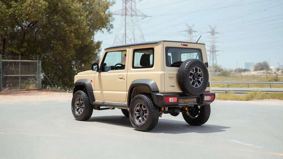 Used 2025 Suzuki Jimny GLX in Beige – Left Back Diagonal (45°) View for Sale at First Choice Cars Dubai Sharjah