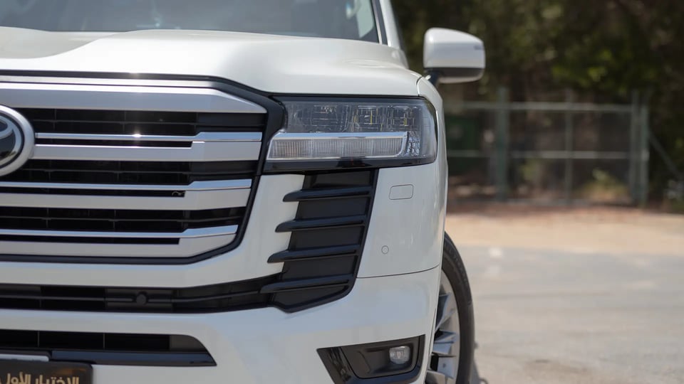 Used 2024 Toyota Land Cruiser GXR in White – Headlight Close-up for Sale at First Choice Cars Dubai Sharjah