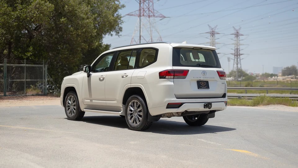 Used 2024 Toyota Land Cruiser GXR in White – Left Back Diagonal (45°) View for Sale at First Choice Cars Dubai Sharjah