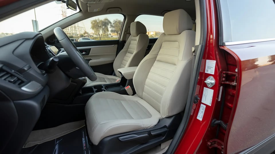 Used 2021 Honda CR-V LX in Red – Front Driver Side Cabin View for Sale at First Choice Cars Dubai Sharjah