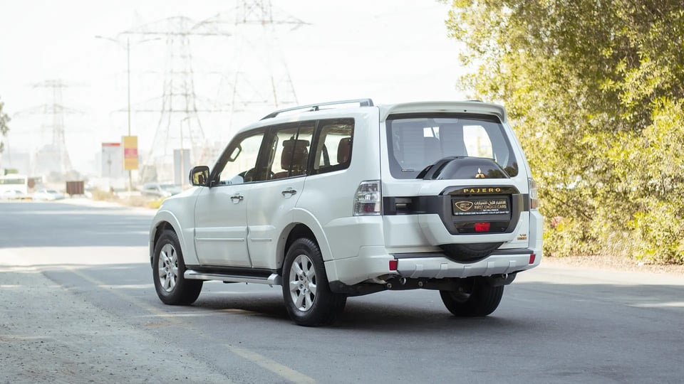 Used 2022 Mitsubishi Pajero GLS in White – Left Back Diagonal (45°) View for Sale at First Choice Cars Dubai Sharjah