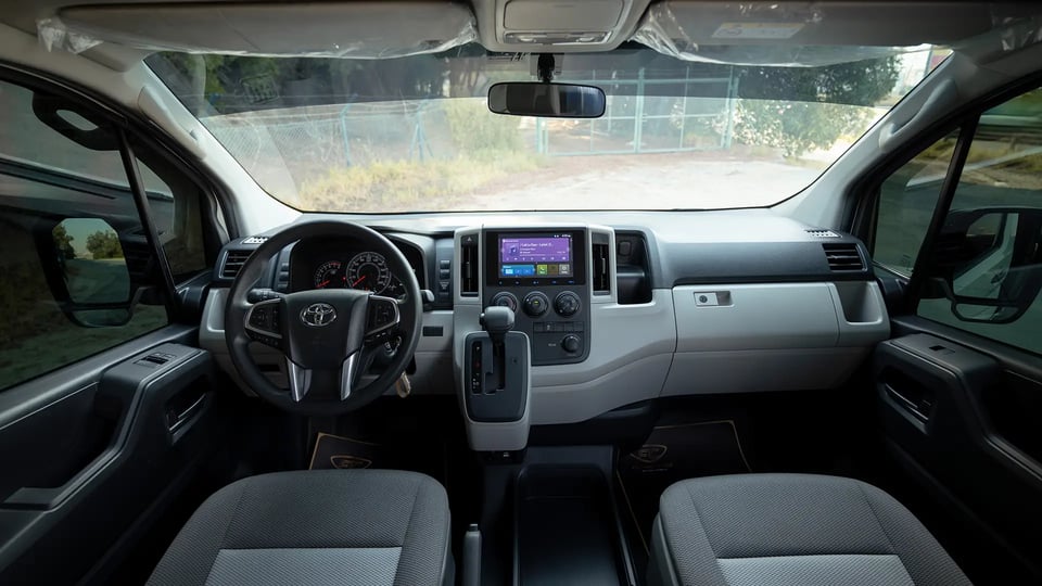 Used 2025 Toyota Hiace GLX High Roof in White – Front Cabin / Dashboard Full View for Sale at First Choice Cars Dubai Sharjah