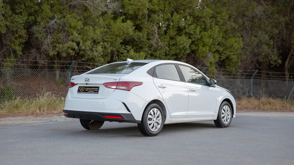 Used 2023 Hyundai Accent Smart in White – Right Back Diagonal (45°) View for Sale at First Choice Cars Dubai Sharjah
