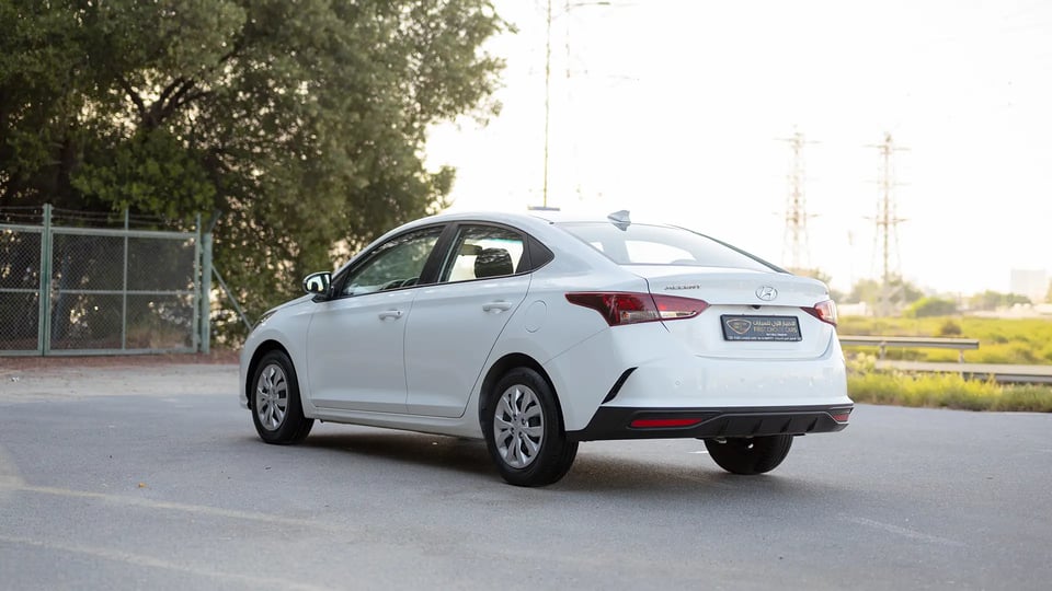Used 2023 Hyundai Accent Smart in White – Left Back Diagonal (45°) View for Sale at First Choice Cars Dubai Sharjah