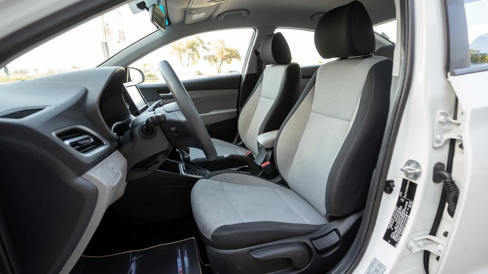 Used 2023 Hyundai Accent Smart in White – Front Driver Side Cabin View for Sale at First Choice Cars Dubai Sharjah