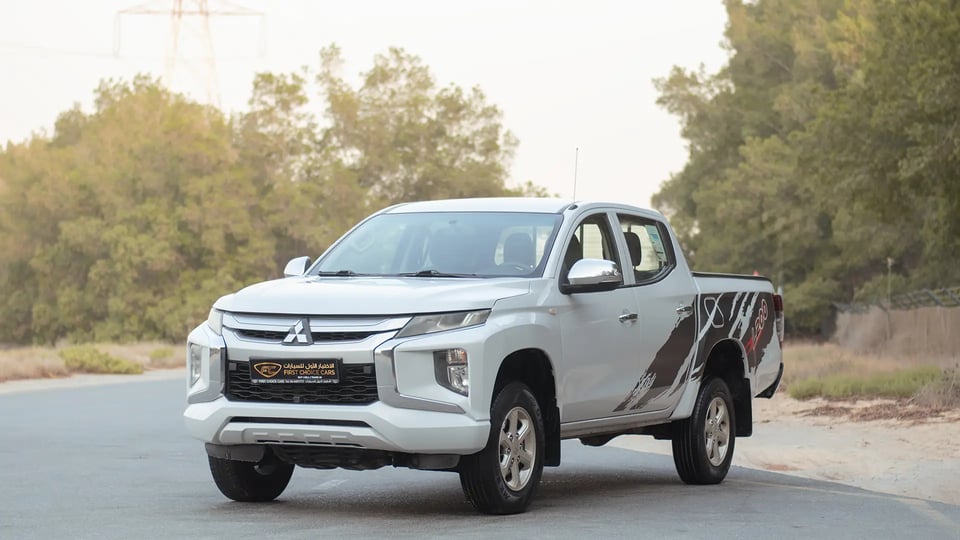 Used 2020 Mitsubishi L200 GLX Double Cabin in White – Left Front Diagonal (45°) View for Sale at First Choice Cars Dubai Sharjah