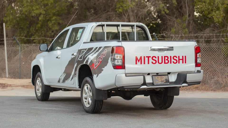 Used 2020 Mitsubishi L200 GLX Double Cabin in White – Left Back Diagonal (45°) View for Sale at First Choice Cars Dubai Sharjah