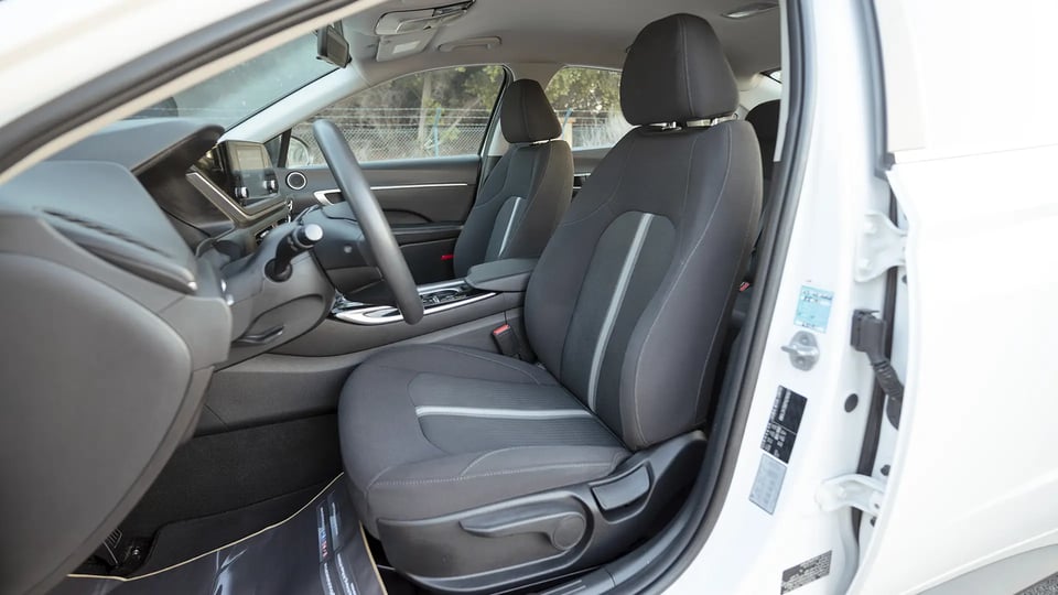 Used 2023 Hyundai Sonata Comfort in White – Front Driver Side Cabin View for Sale at First Choice Cars Dubai Sharjah