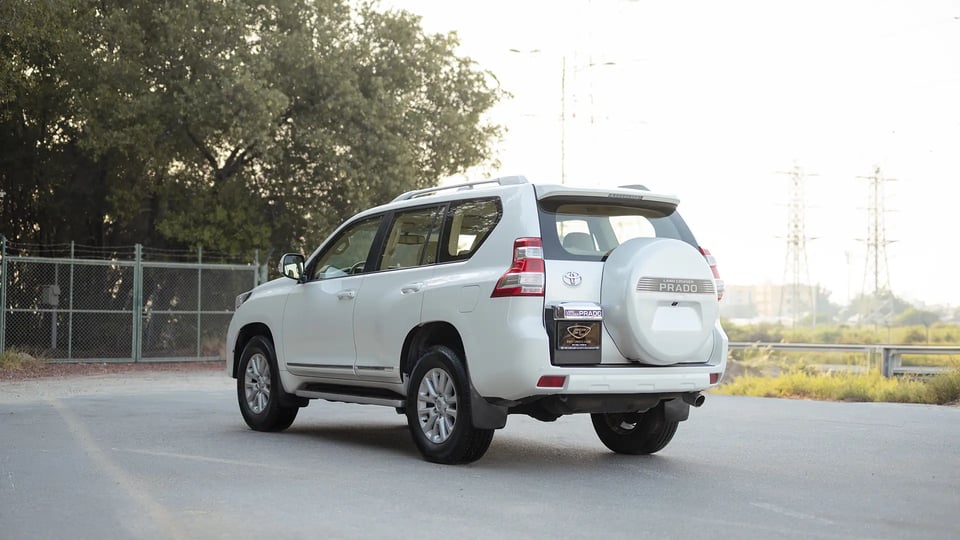 Used 2016 Toyota Prado VXR in White – Left Back Diagonal (45°) View for Sale at First Choice Cars Dubai Sharjah