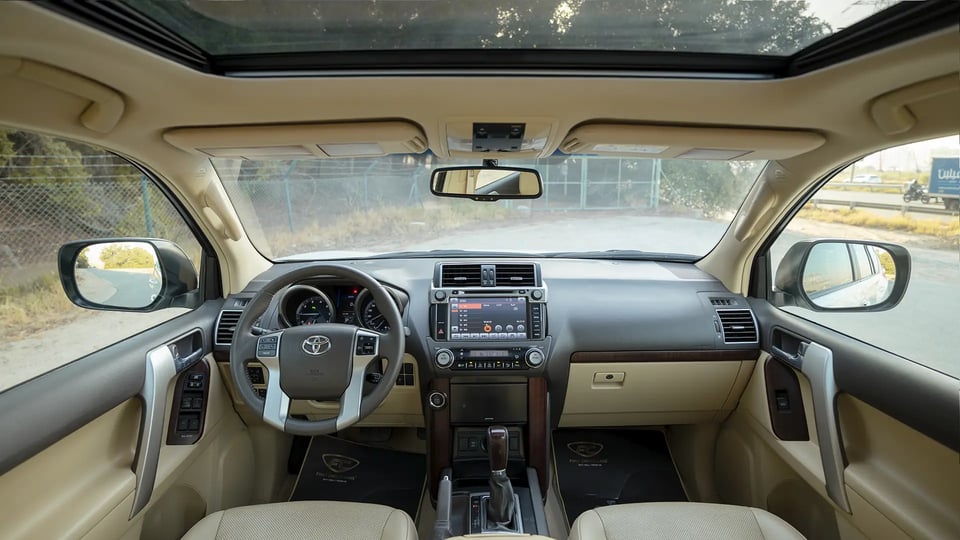 Used 2016 Toyota Prado VXR in White – Front Cabin / Dashboard Full View for Sale at First Choice Cars Dubai Sharjah