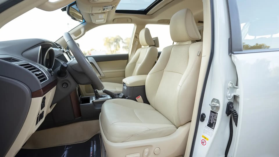 Used 2016 Toyota Prado VXR in White – Front Driver Side Cabin View for Sale at First Choice Cars Dubai Sharjah