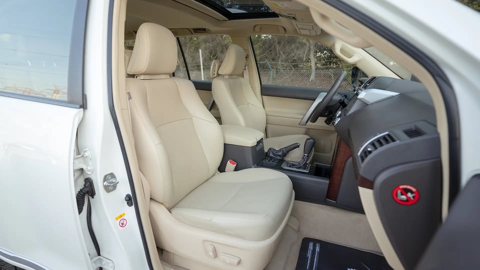Used 2016 Toyota Prado VXR in White – Front Passenger Side Cabin View for Sale at First Choice Cars Dubai Sharjah