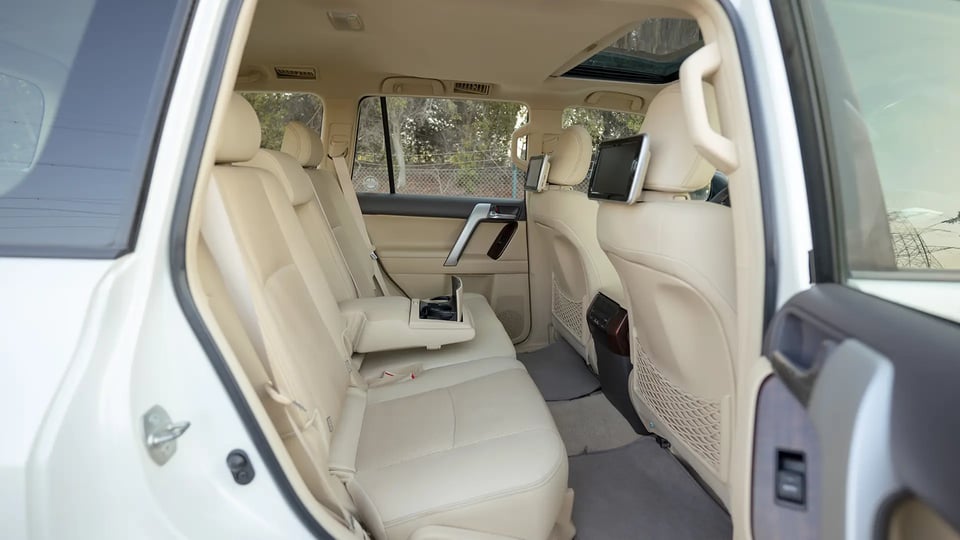 Used 2016 Toyota Prado VXR in White – Rear Passenger Side Cabin View for Sale at First Choice Cars Dubai Sharjah